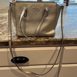 Kate Spade leather purse 13 L x 5 W x 8 H. Silver.